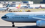 Cathay flight delayed after cleaner triggers emergency slide